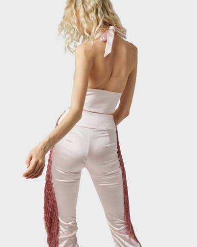 Embrace a charming and stylish look with the Dolly Fringe Pant in Light Pink. These pants feature delightful fringe detailing, adding a playful touch to your wardrobe in a soft and feminine light pink hue.