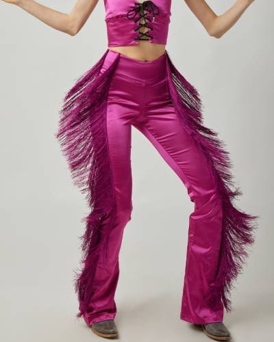 Embrace a playful and chic look with the Dolly Fringe Pant in Pink. These stylish pants feature fringe detailing, adding a touch of fun and flair to your wardrobe. Perfect for making a bold fashion statement in a vibrant pink hue.