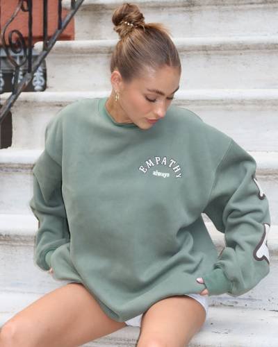Empathy Always Olive Crewneck - A versatile and stylish olive-colored crewneck spreading the message of empathy, because kindness is a timeless expression.