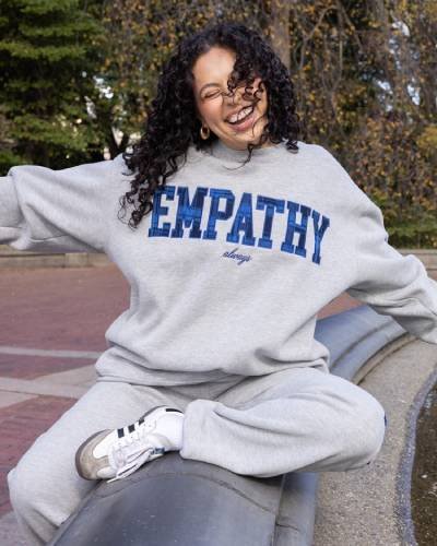 Empathy Always Plaid Crewneck - A cozy and stylish plaid-patterned crewneck spreading the message of empathy, because kindness is always in fashion.