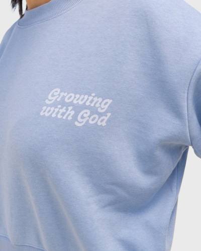 Growing with God Cropped Crewneck: Embrace spiritual growth with this trendy cropped crewneck, featuring a meaningful message for a stylish and faith-inspired look.