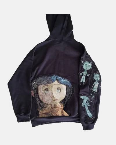 A handmade tapestry hoodie, inspired by Coraline's whimsical world, threads weaving dreams and adventures into reality.