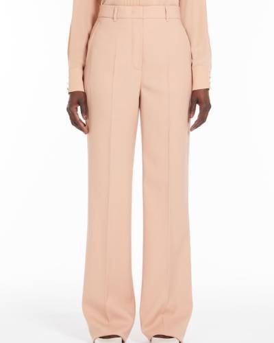 Elevate your wardrobe with these Long Wool Crepe Trousers, a perfect blend of sophistication and comfort. The trousers feature a sleek design in luxurious wool crepe, providing a versatile and stylish option for a modern and chic look.