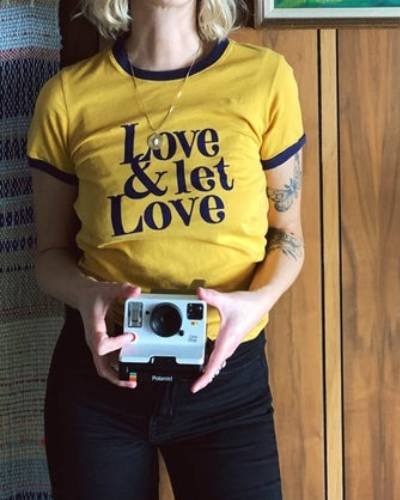 Love & Let Love Shirt in Mustard, a vibrant and positive fashion statement promoting love and acceptance.