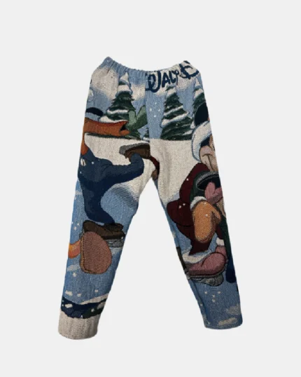 Mickey N Crew Tapestry Pants," a playful and stylish pair of pants featuring a tapestry design with the iconic Mickey Mouse and friends for a fun and comfortable fashion statement.