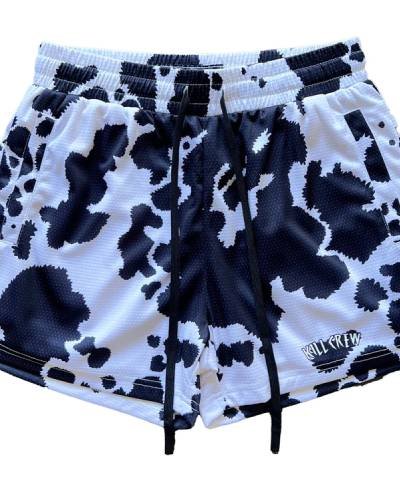 Moo Thai Shorts with mid-thigh cut in a sleek black cow design - a stylish choice for training.