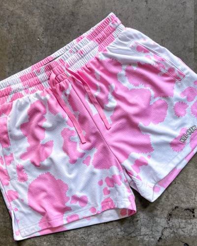 Moo Thai Shorts with mid-thigh cut featuring a vibrant pink cow design - a fun and stylish choice