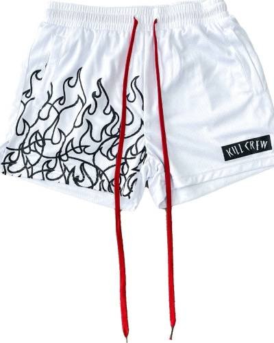 Muay Thai Flame Shorts with mid-thigh cut in bold white and black - ignite your training with style.