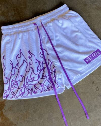 Muay Thai Flame Shorts with mid-thigh cut in stylish white and purple - add flair to your training