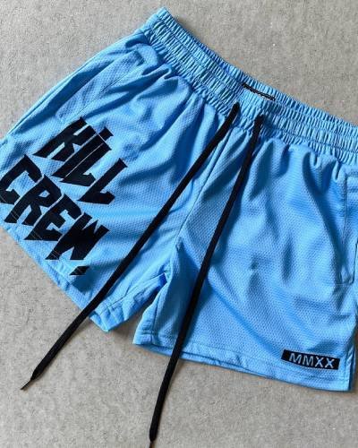 Muay Thai Shorts with mid-thigh cut in vibrant blue - perfect for training with style and flair.