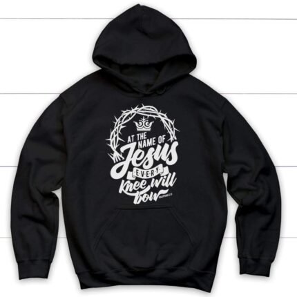 Christian hoodie with "Philippians: Every knee will bow" text referencing Jesus, on dark fabric.
