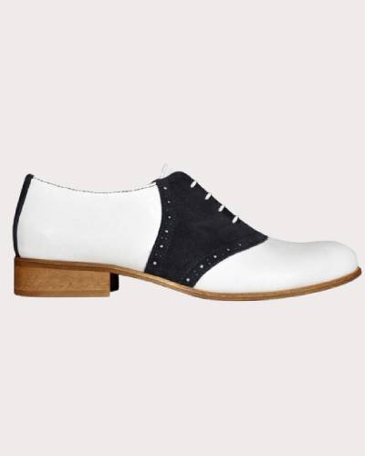 Stoker Saddle Shoes in White/Black, a classic and stylish footwear choice featuring a timeless design with a white base and black accents.