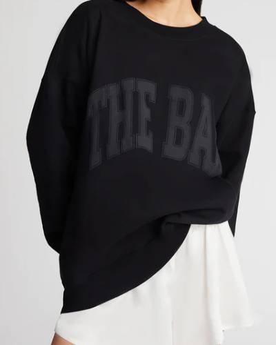 Black varsity-style sweatshirt, a sleek and timeless choice for your casual wardrobe collection.