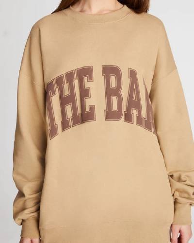 Chocolate chip varsity-style sweatshirt, a deliciously stylish addition to your casual wardrobe collection.