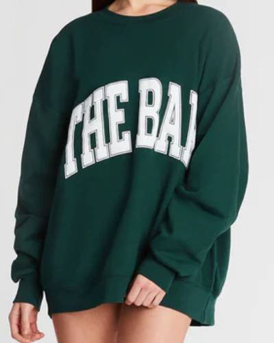 Hunter green varsity-style sweatshirt, adds a bold touch to your casual wardrobe ensemble.