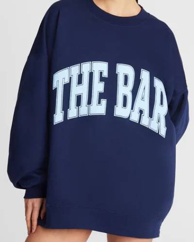 Navy and baby blue varsity-style sweatshirt, combining classic colors for a timeless look.