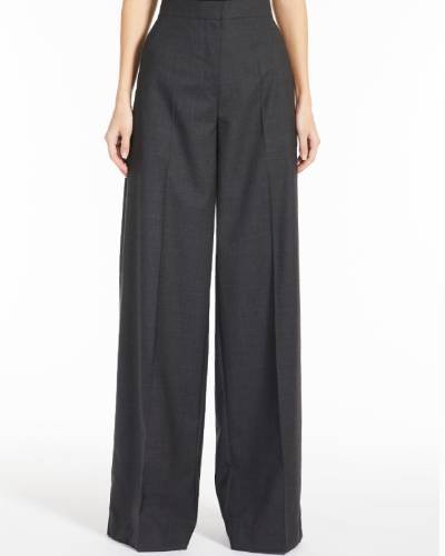 Embrace chic elegance with these Black Wool Palazzo Trousers, a stylish and versatile addition to your wardrobe. The trousers feature a wide-leg silhouette in luxurious wool, offering a modern and sophisticated option for a timeless and fashionable look.